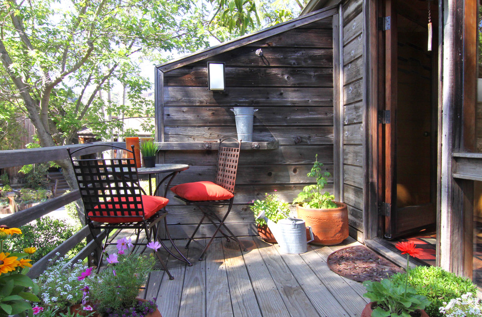 This is an example of a rustic terrace in Orange County with no cover.