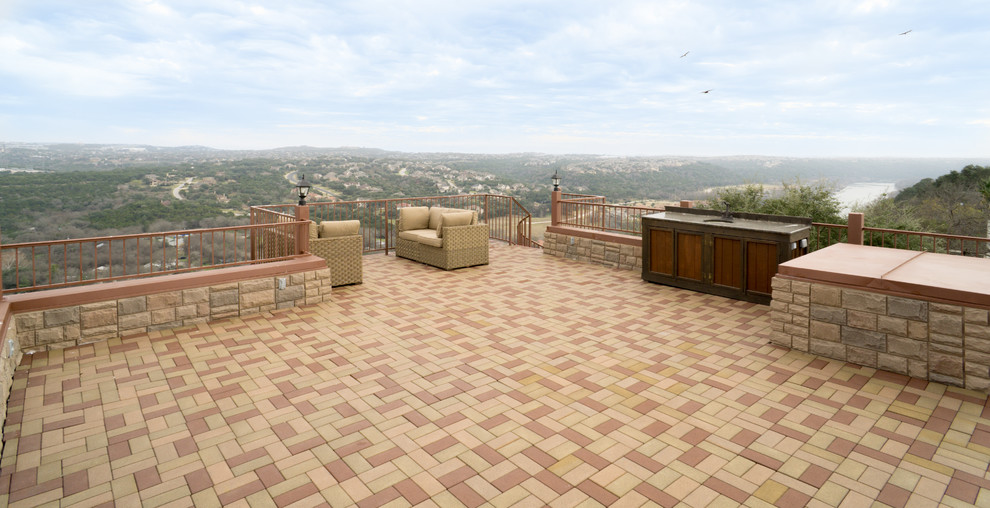 Inspiration for a huge mediterranean rooftop deck remodel in Austin with no cover