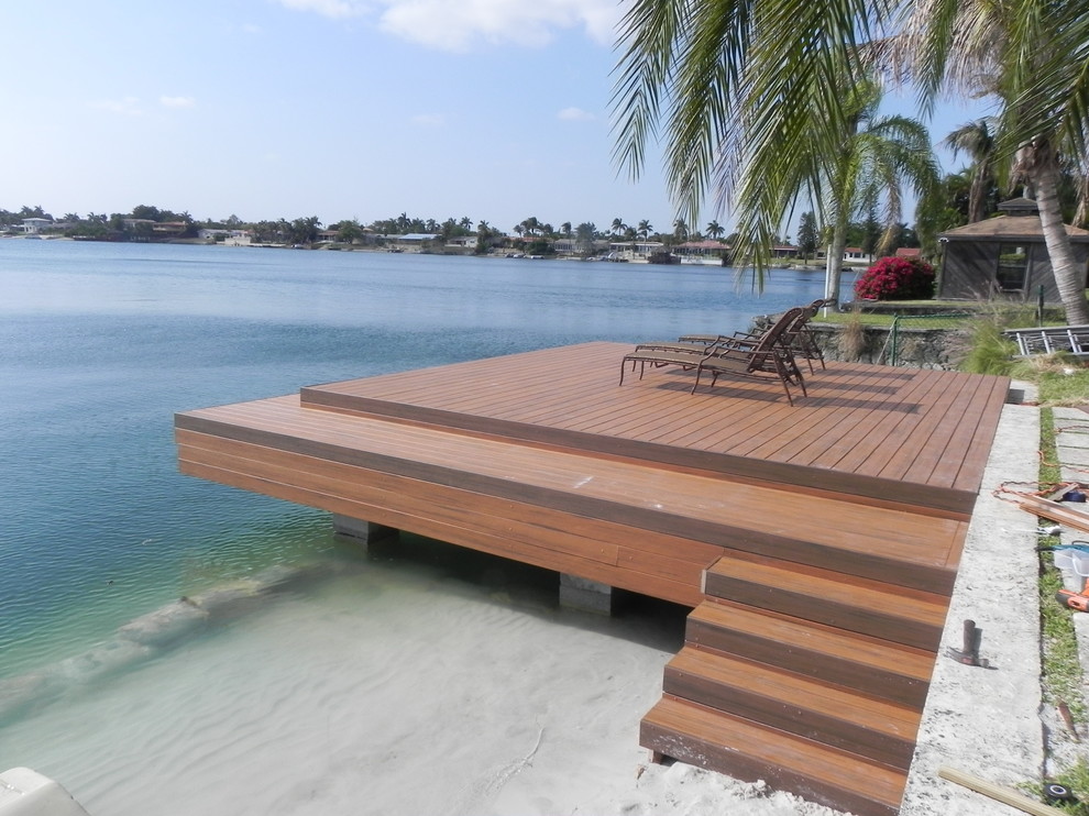 Dock - mid-sized coastal backyard dock idea in Miami with no cover