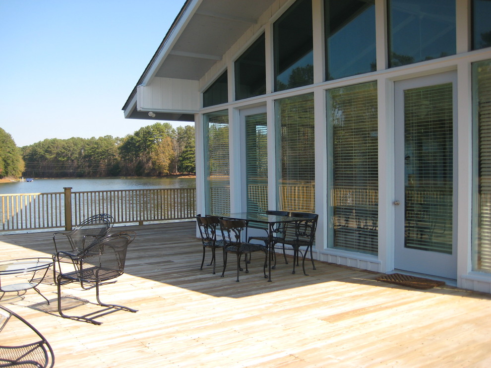 Expansive contemporary side terrace in Atlanta with a dock and no cover.