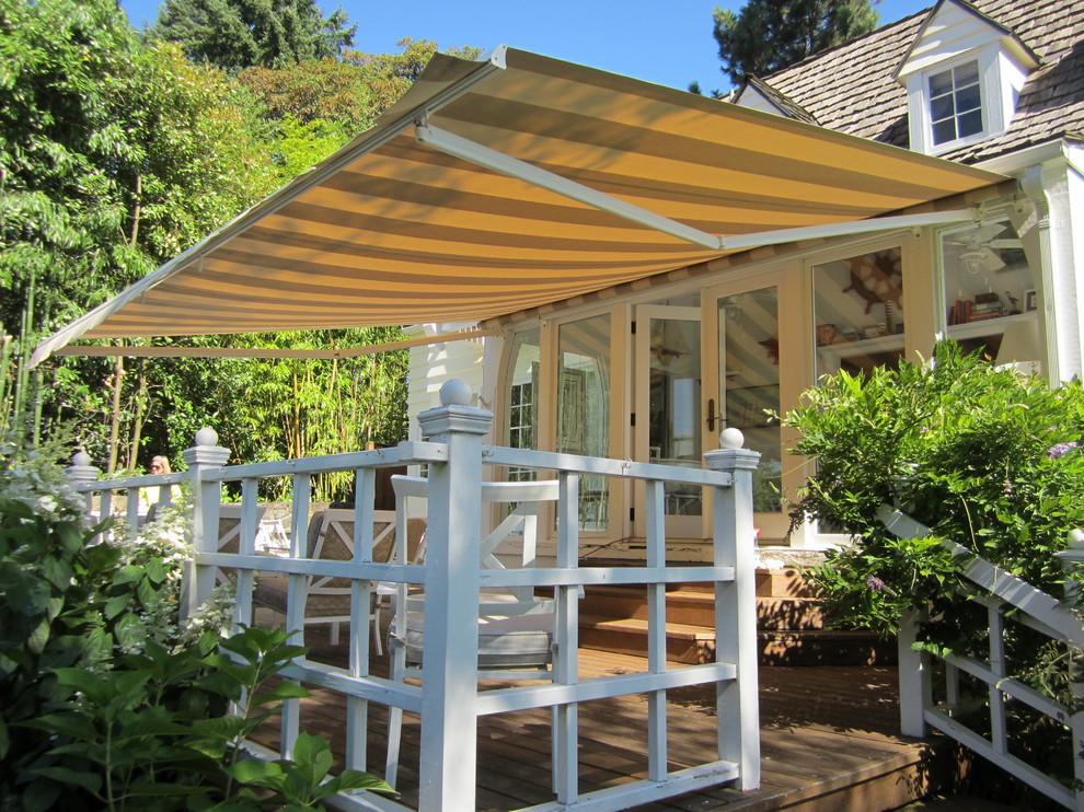 Design ideas for a medium sized classic back terrace in Portland with a dock and an awning.