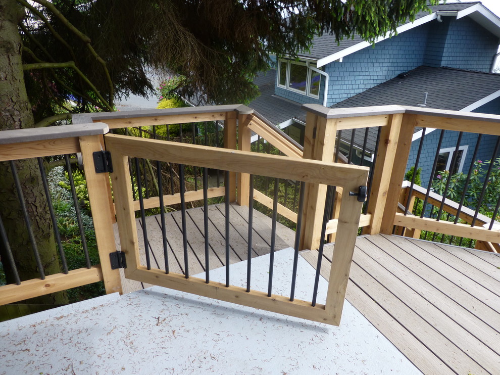Mid-sized mountain style side yard deck photo in Seattle with no cover