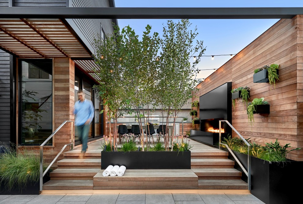 Идея дизайна: терраса на боковом дворе в современном стиле с зоной барбекю без защиты от солнца