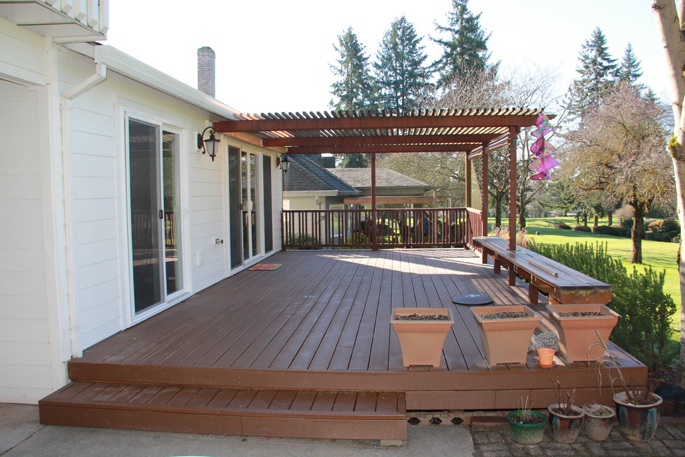 Inspiration for a mid-sized contemporary backyard deck remodel in Other with a pergola