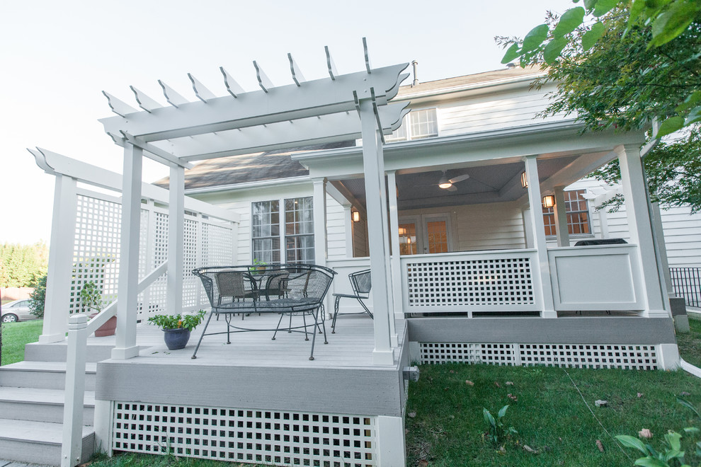 Inspiration for a large transitional backyard deck remodel in DC Metro with a pergola