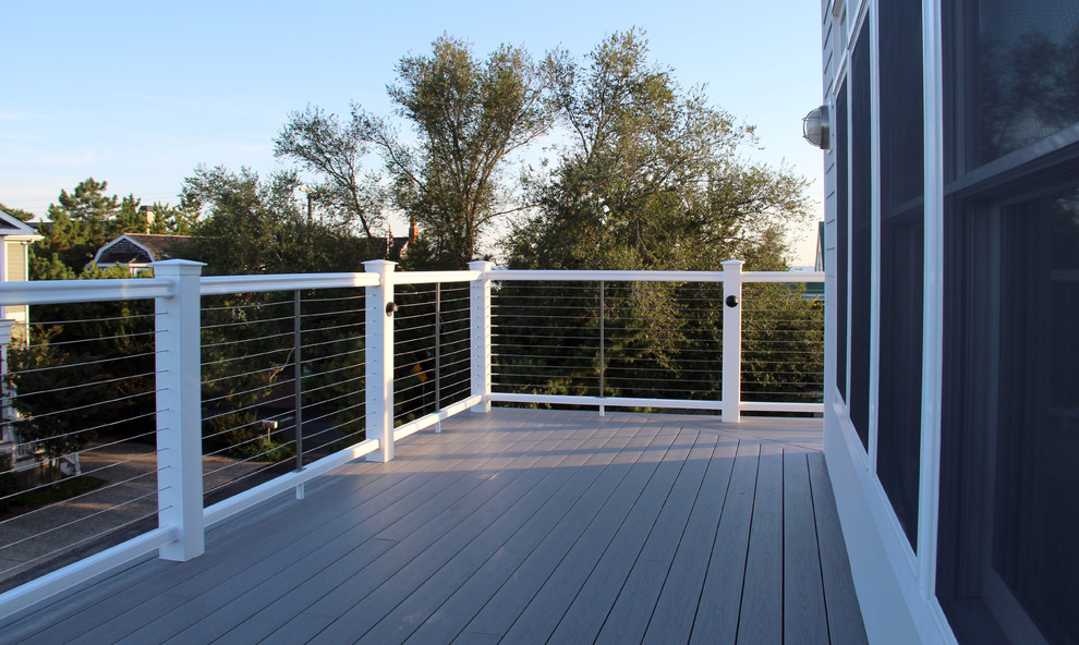 This is an example of a large nautical roof terrace in Other with no cover.