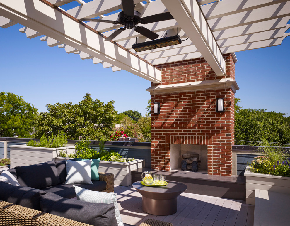 This is an example of a large classic roof rooftop terrace in Chicago with a pergola and a potted garden.