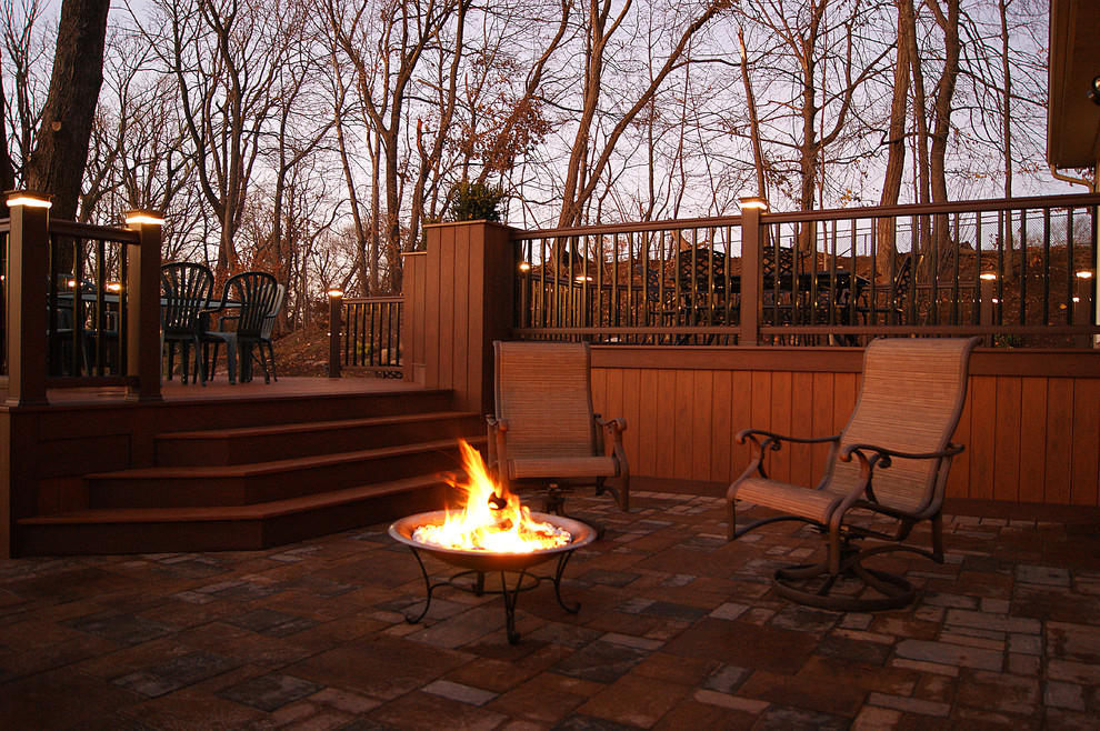 Example of a huge classic backyard patio design in New York with a fire pit and a pergola