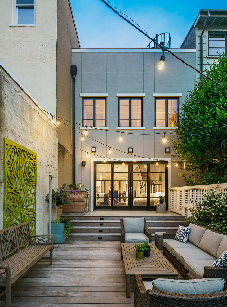 Photo of a traditional back terrace in DC Metro with an outdoor kitchen, feature lighting and no cover.