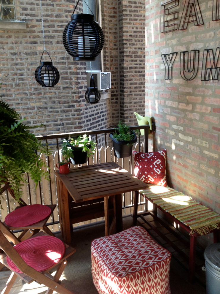 Inspiration for a small contemporary back terrace in Chicago with a potted garden.