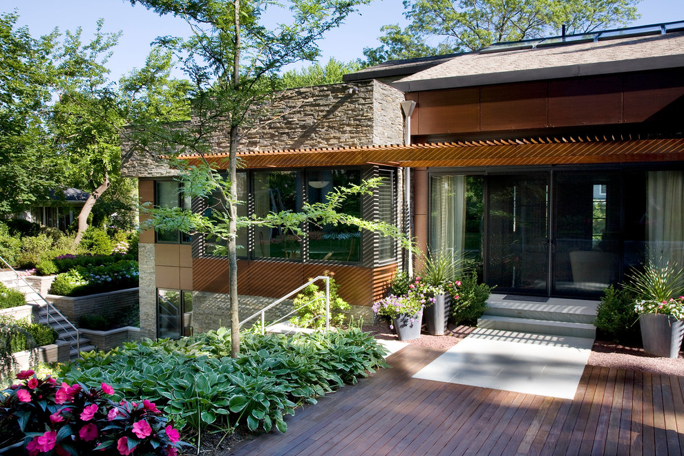 Example of an eclectic deck design in New York with a pergola