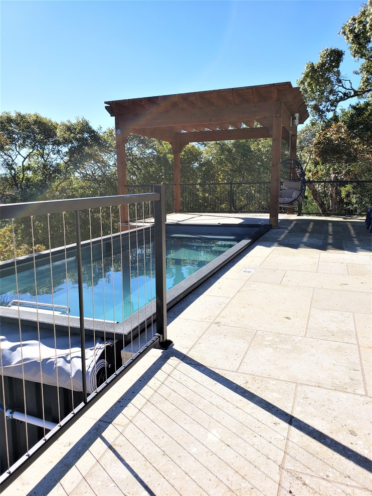 Inspiration for a large contemporary backyard deck remodel in Austin with a pergola