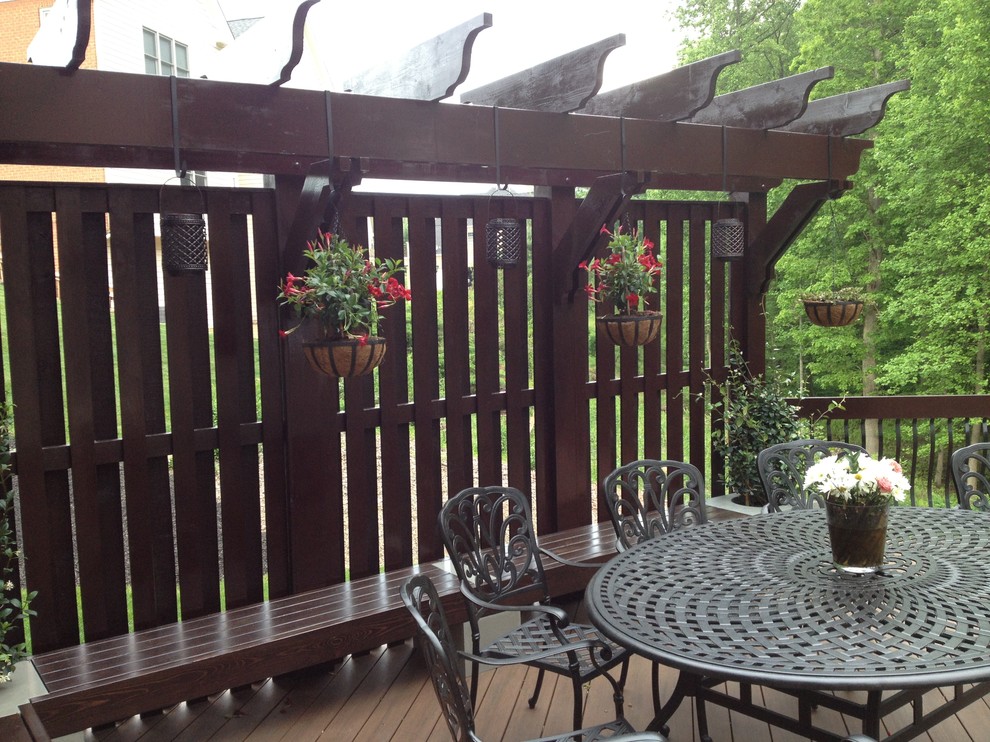 Deck - large transitional backyard deck idea in DC Metro with a pergola