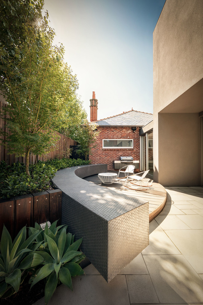 Design ideas for a contemporary back terrace in Melbourne with a bbq area.
