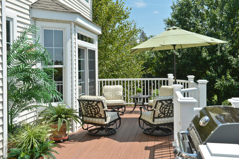 Inspiration for a large timeless backyard deck remodel in New York