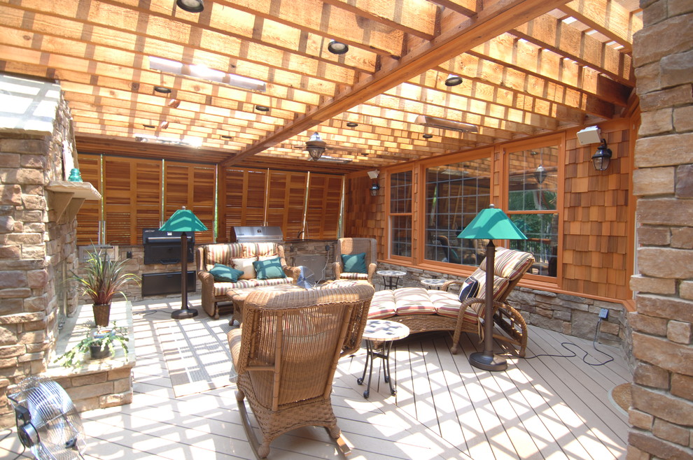 Inspiration for a huge rustic backyard outdoor kitchen deck remodel in Atlanta with a pergola