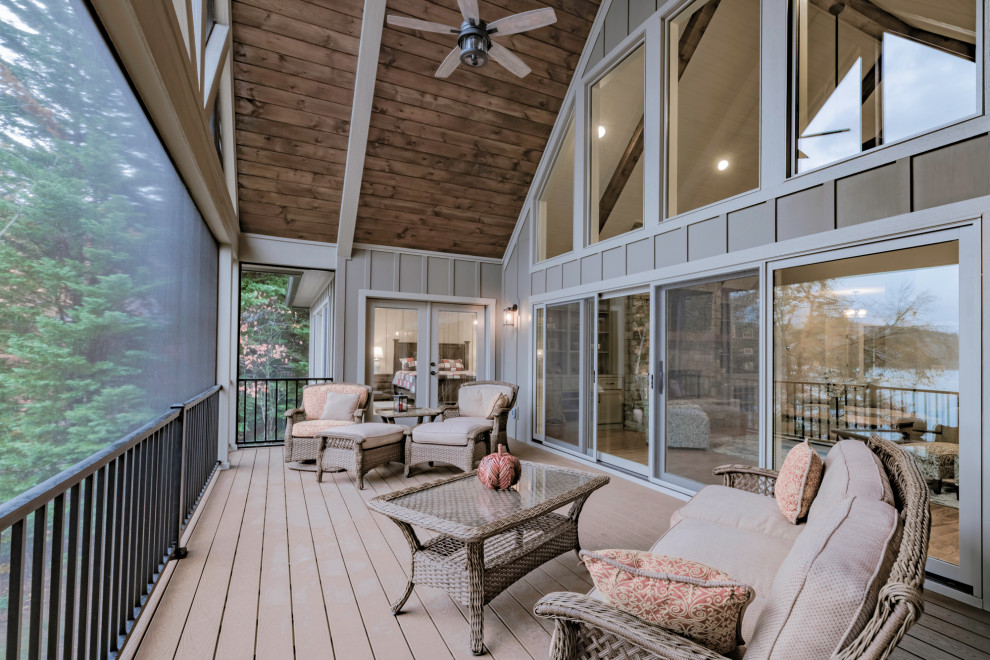 This is an example of a large rustic back terrace in Atlanta with a dock and a roof extension.