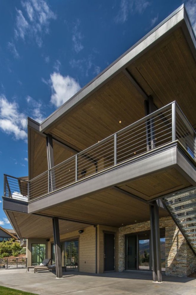 Photo of a medium sized contemporary terrace in Salt Lake City with a roof extension.