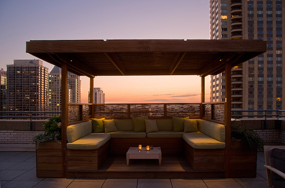 Medium sized bohemian roof terrace in Chicago with a pergola.