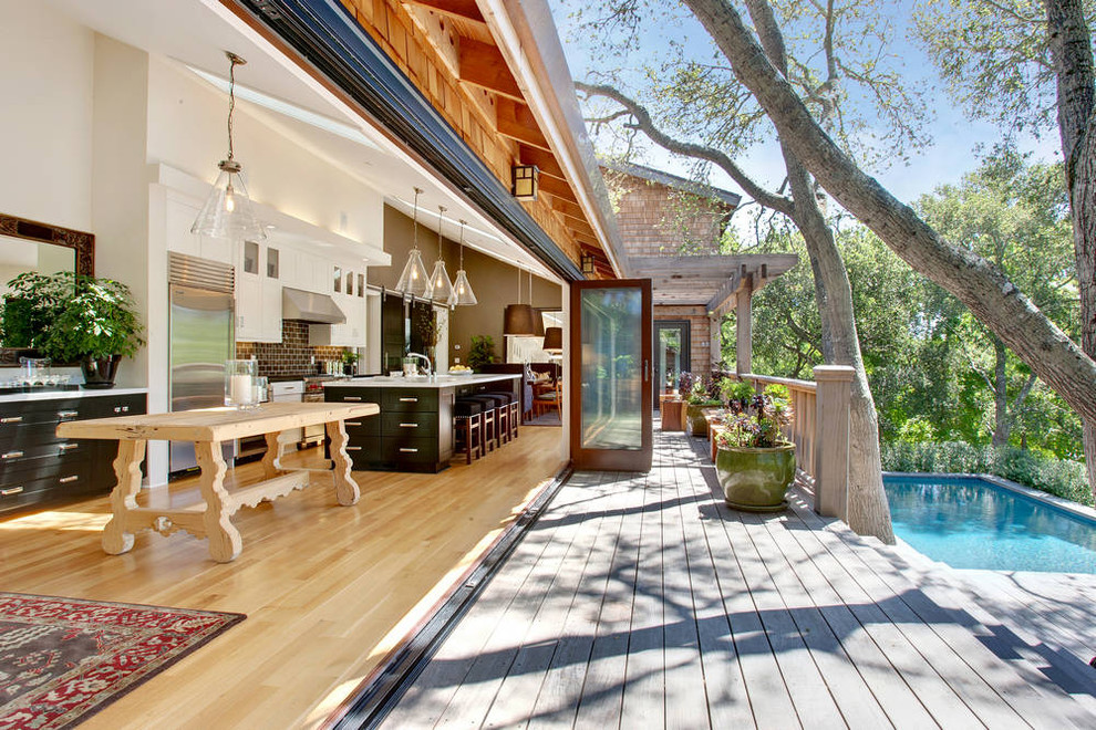 Deck - transitional deck idea in San Francisco with a pergola