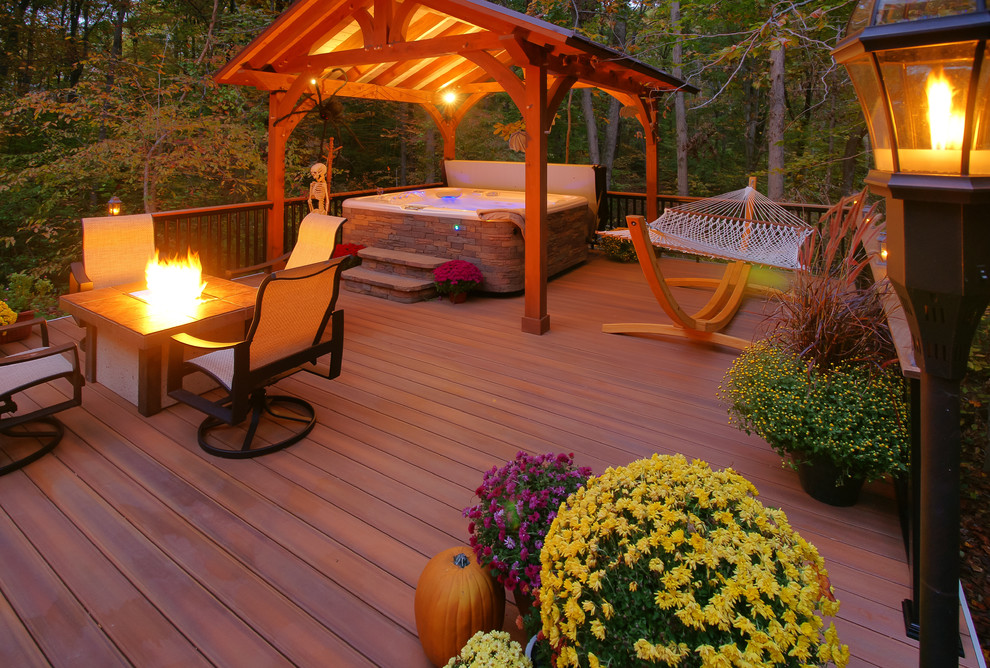 Deck - large traditional backyard deck idea in DC Metro with a fire pit