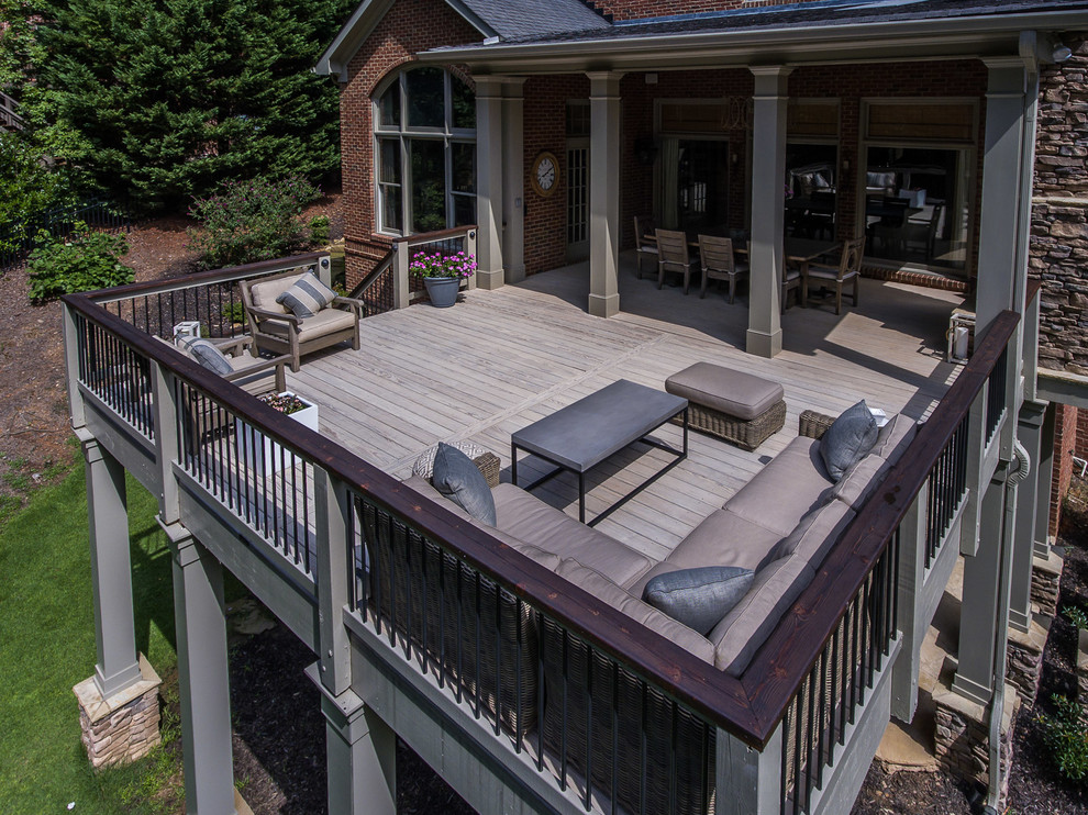 Deck - large transitional backyard deck idea in Atlanta with a roof extension