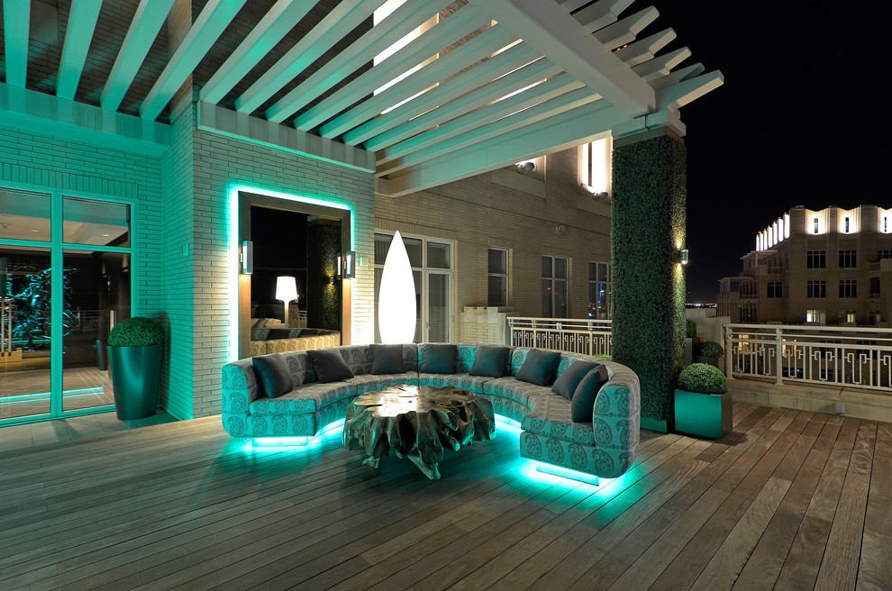 Trendy deck photo in Dallas with a pergola
