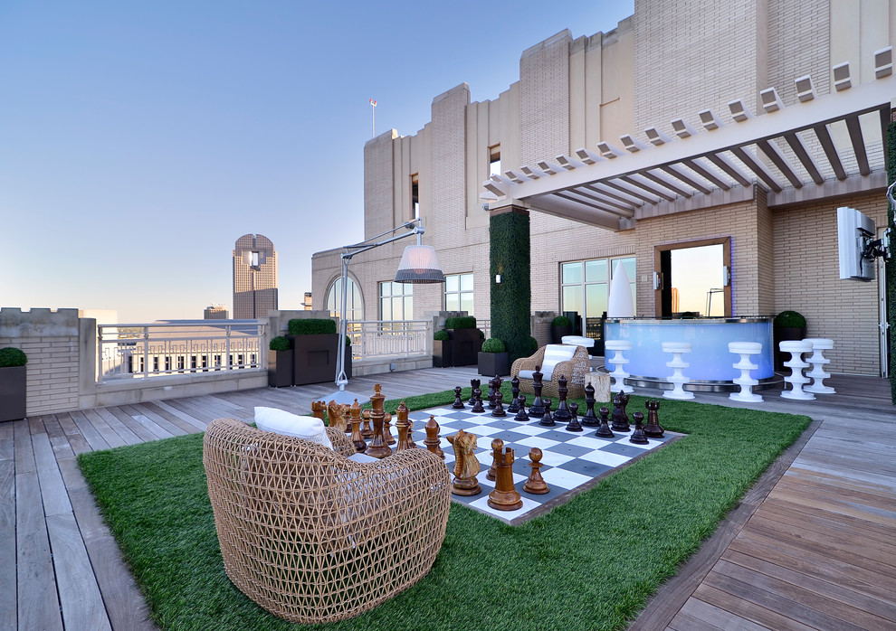 Trendy deck photo in Dallas with a pergola