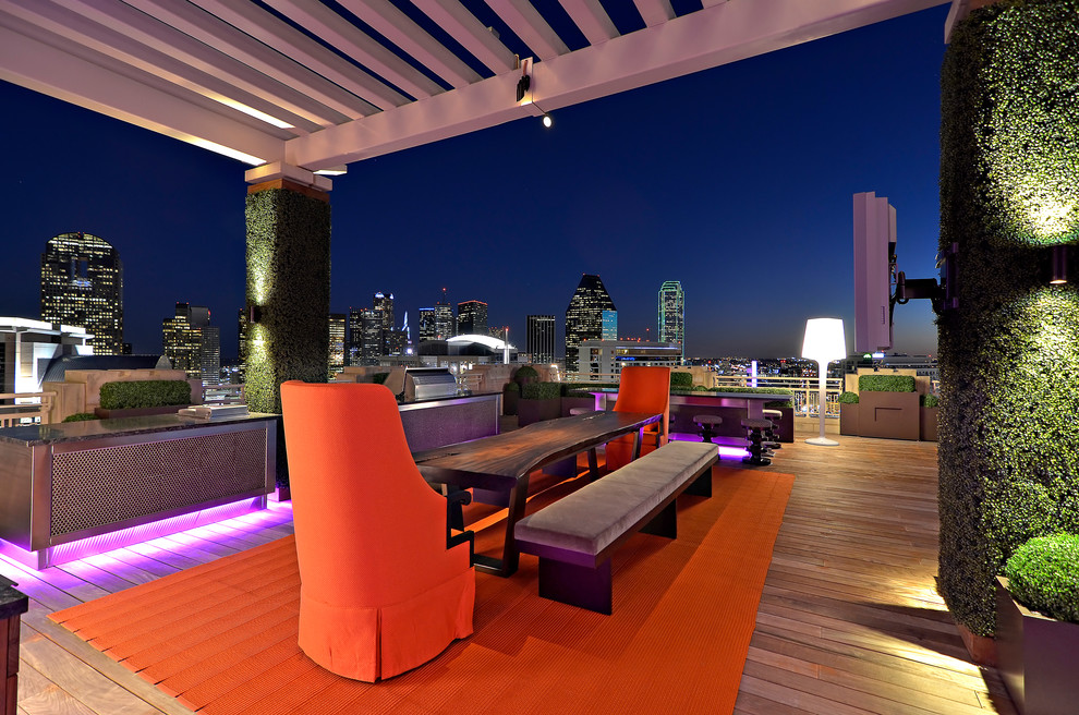 Inspiration for a contemporary deck remodel in Dallas with a pergola