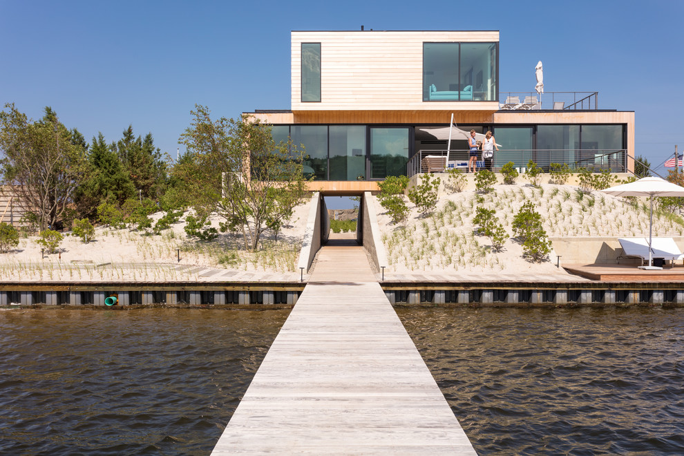 Inspiration for a huge coastal backyard deck remodel in New York