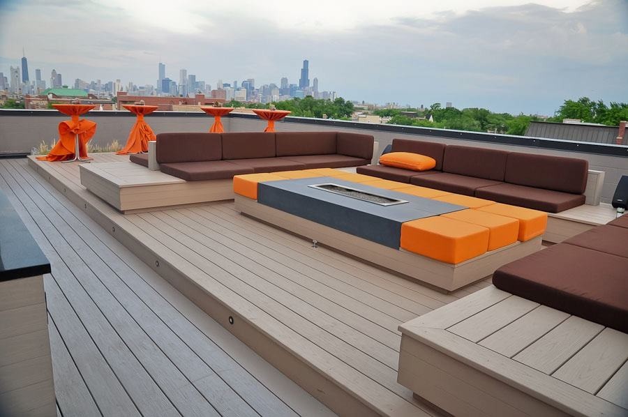 Deck - large modern rooftop deck idea in Chicago with a fire pit and no cover