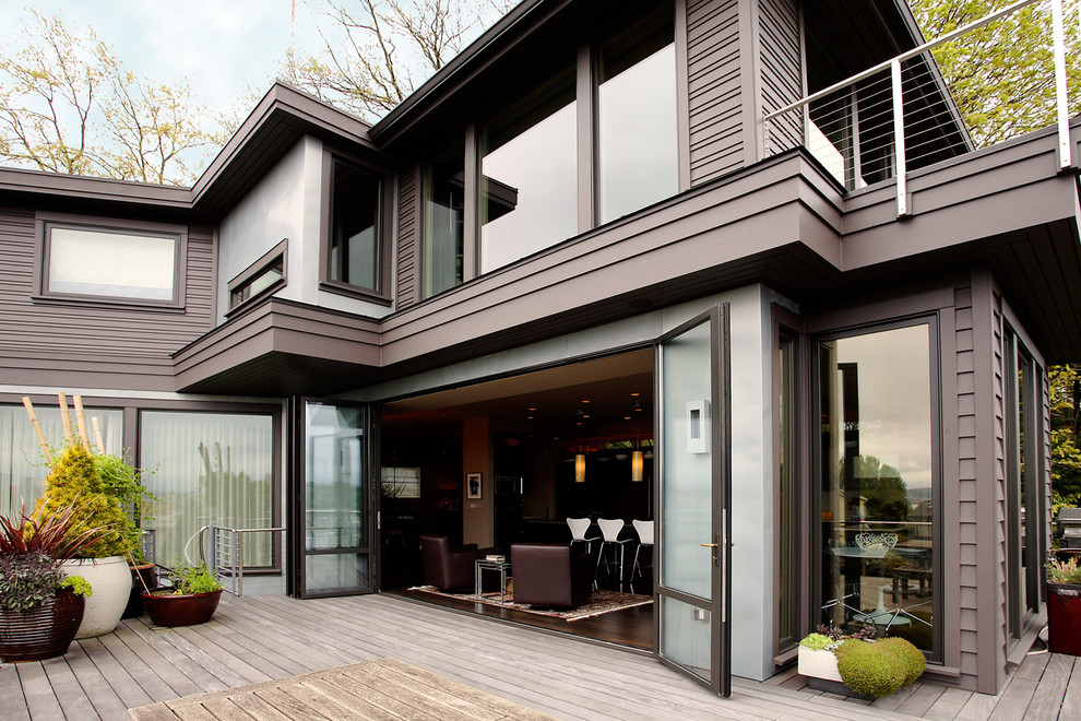 Photo of a large modern back terrace in Seattle with no cover.