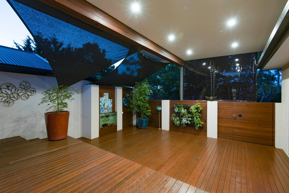 Design ideas for a large contemporary back terrace in Canberra - Queanbeyan with a living wall and a pergola.