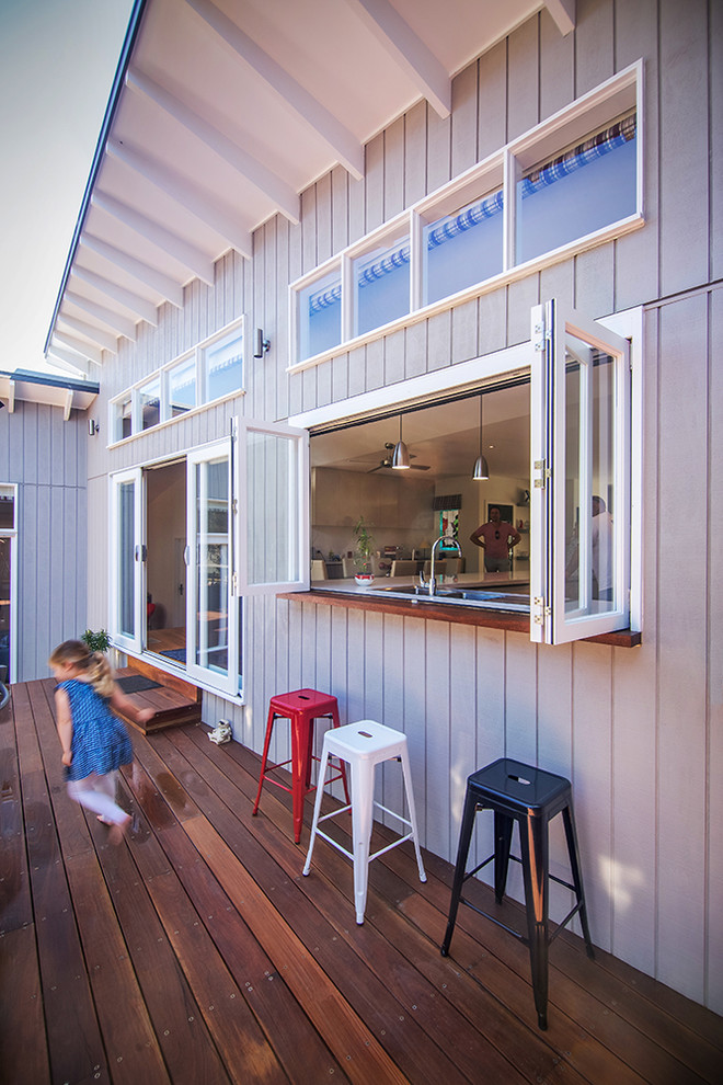 Large beach style backyard deck photo in Melbourne
