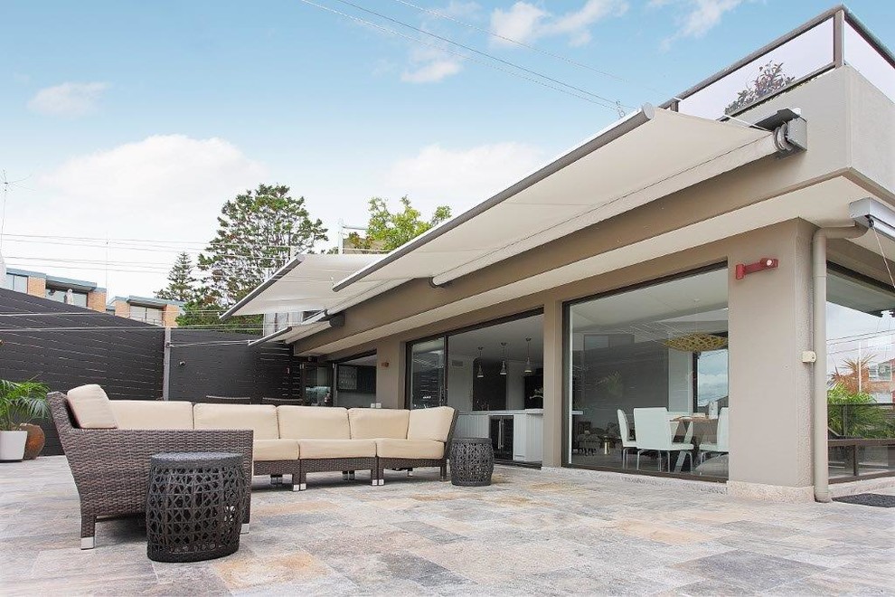 Design ideas for a classic roof terrace in Sydney with an awning.