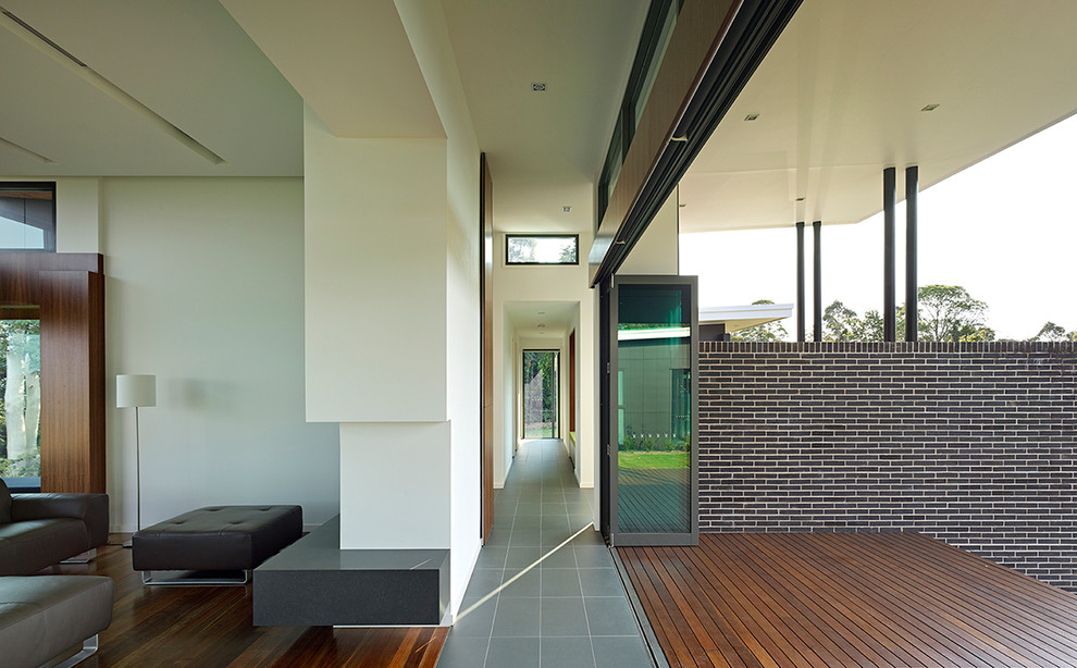 Contemporary back terrace in Brisbane with a roof extension.