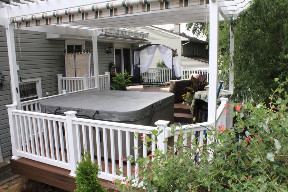 Mid-sized elegant backyard deck photo in Philadelphia with a pergola