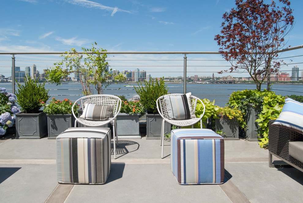 Inspiration for a large contemporary roof terrace in New York with an outdoor kitchen and no cover.