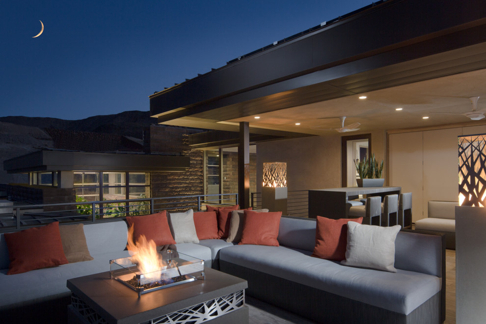 This is an example of a large contemporary roof terrace in Las Vegas with a roof extension.
