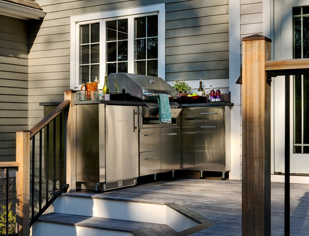 Photo of a small back terrace in Boston with an outdoor kitchen.