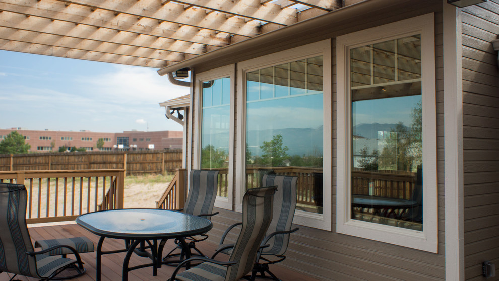 Photo of a medium sized traditional back terrace in Denver with a pergola.