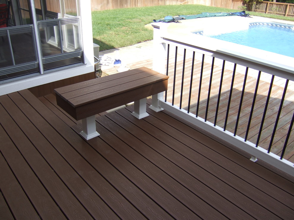 Inspiration for a mid-sized modern backyard deck remodel in Other with a roof extension