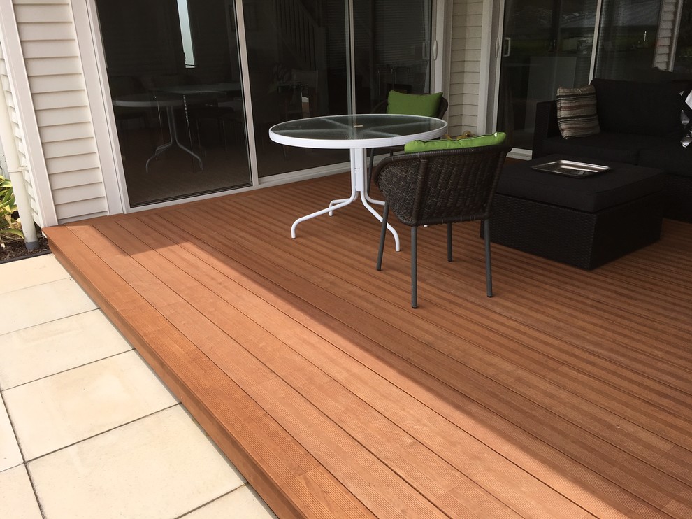 This is an example of a small contemporary side terrace in Auckland with a pergola.