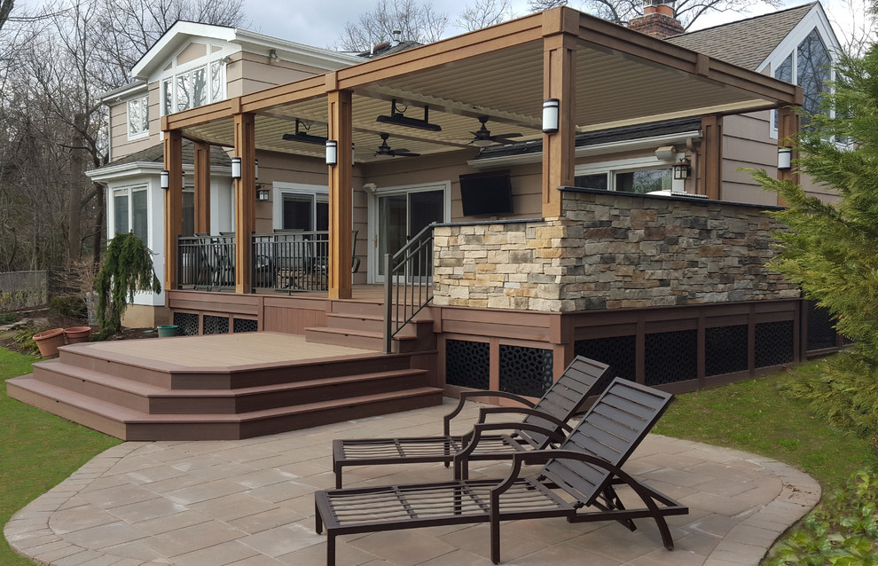 Design ideas for a contemporary back terrace in New York with a pergola.