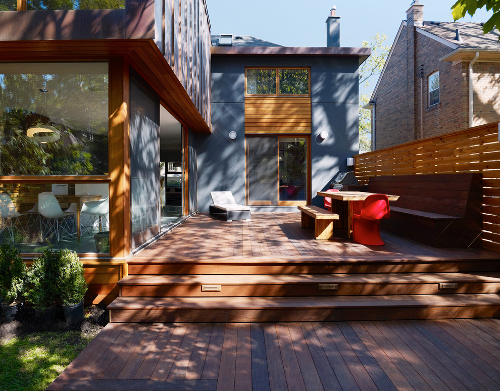Inspiration for a large contemporary back terrace in Toronto with no cover and fencing.