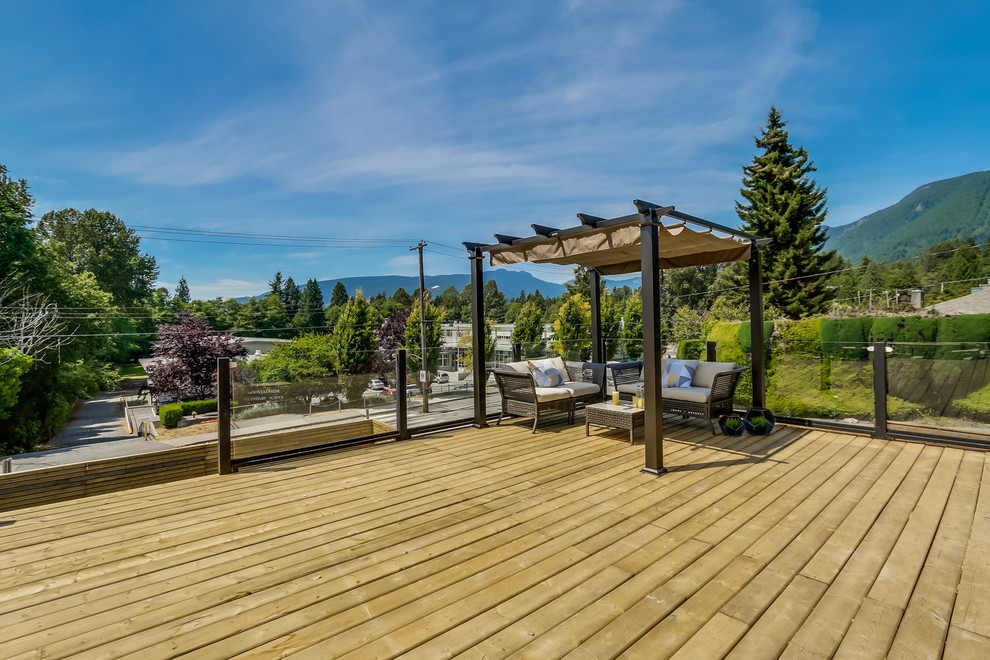 Design ideas for a large contemporary side terrace in Vancouver with a pergola.