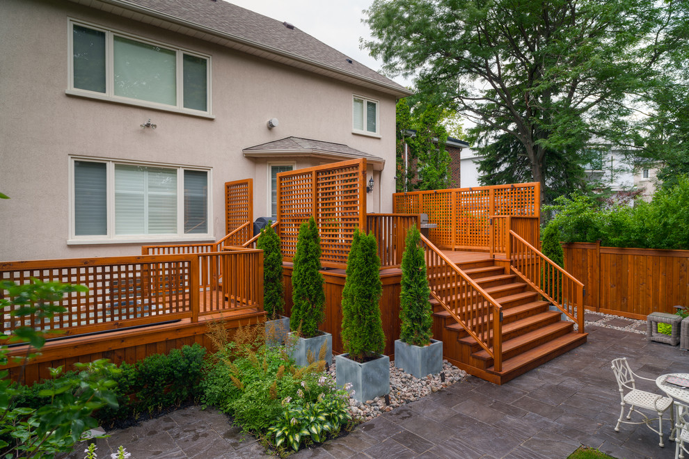 This is an example of a large eclectic back terrace in Toronto.