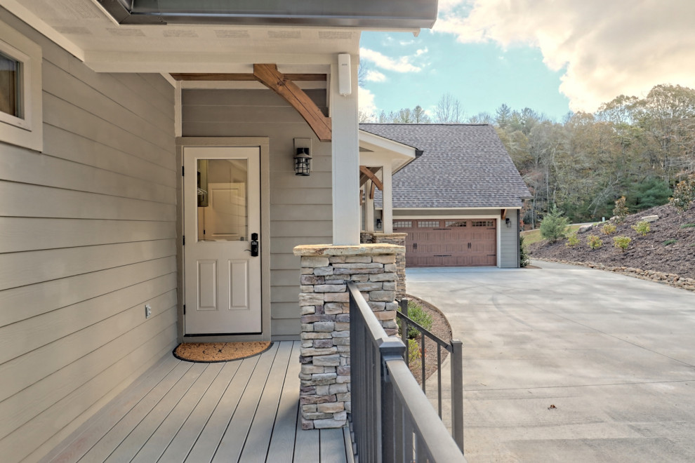 Mid-sized arts and crafts side yard ground level metal railing deck photo in Atlanta with a roof extension
