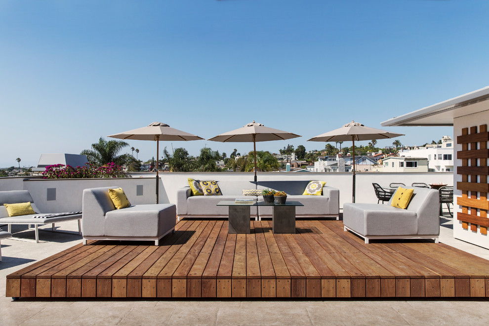 This is an example of a medium sized coastal roof rooftop terrace in Los Angeles with no cover.