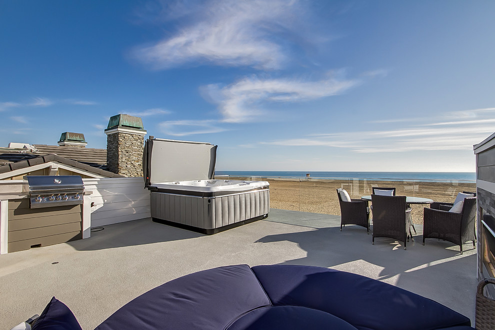 Inspiration for a coastal rooftop deck remodel in Orange County with no cover
